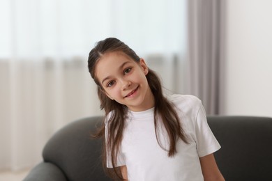 Portrait of beautiful little girl indoors. Cute child