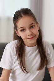 Portrait of beautiful little girl indoors. Cute child