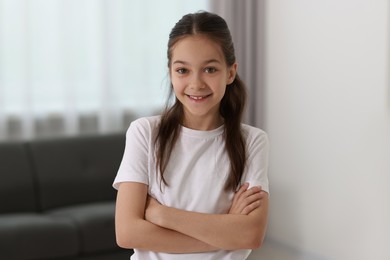 Portrait of happy little girl indoors. Cute child