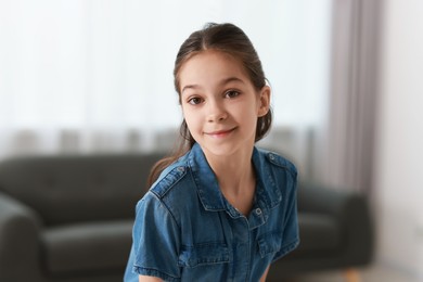 Photo of Portrait of beautiful little girl indoors. Cute child