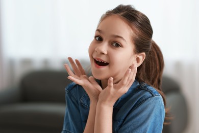 Photo of Portrait of emotional little girl indoors. Cute child