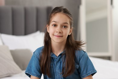 Portrait of beautiful little girl indoors. Cute child