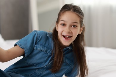 Portrait of happy little girl indoors. Cute child