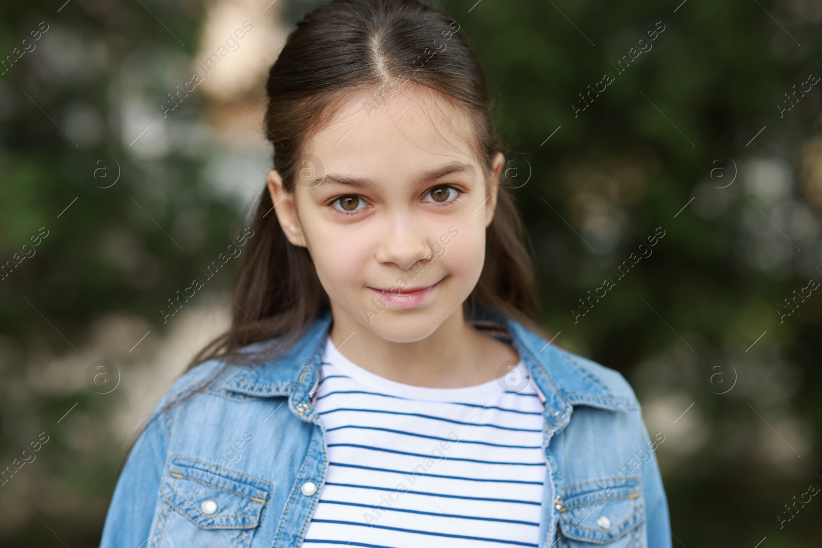 Photo of Portrait of beautiful little girl outdoors. Cute child