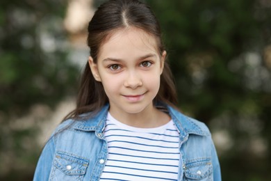 Photo of Portrait of beautiful little girl outdoors. Cute child