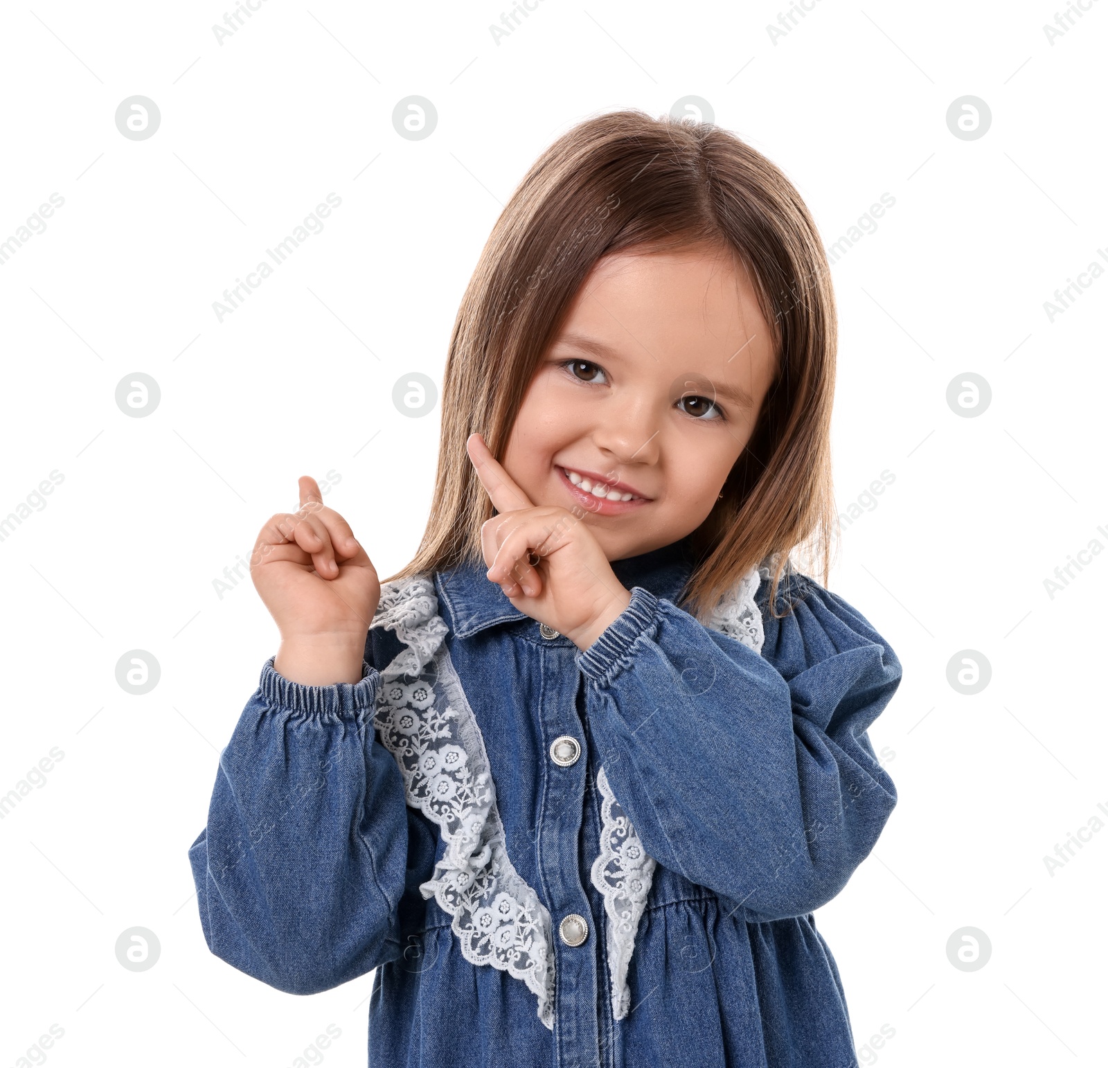 Photo of Portrait of happy little girl pointing at something on white background