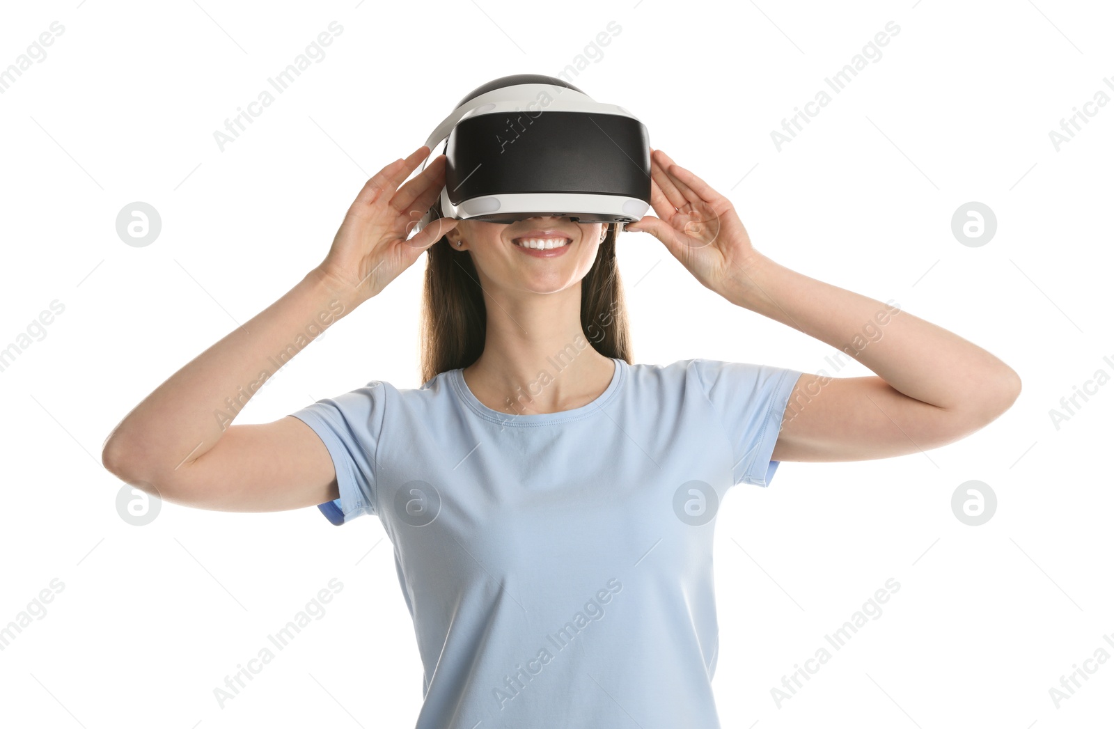 Photo of Smiling woman using virtual reality headset on white background