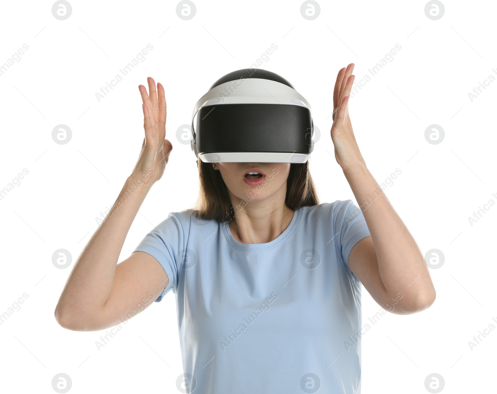 Photo of Surprised woman using virtual reality headset on white background