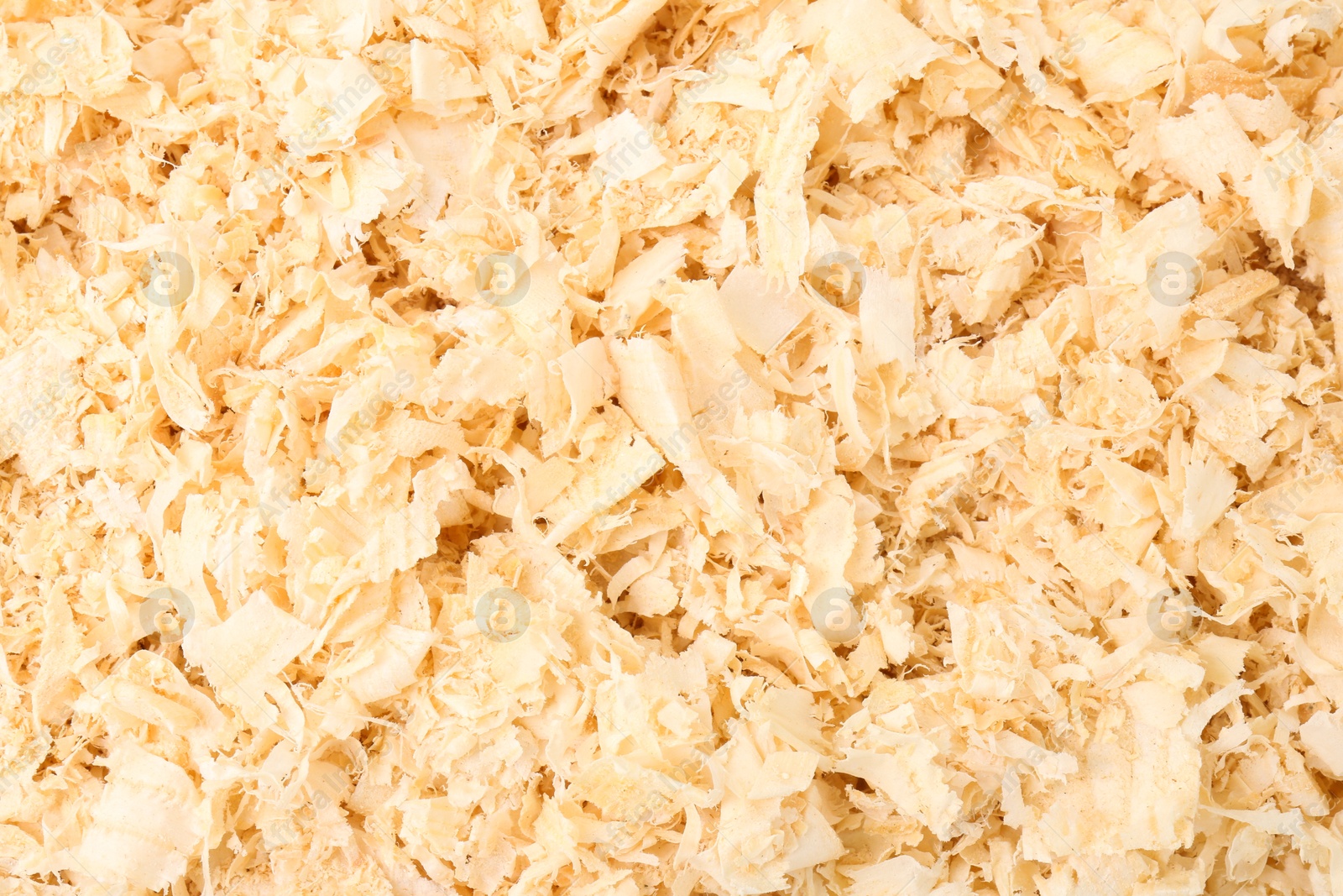 Photo of Pile of natural sawdust as background, top view