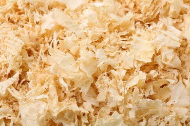 Photo of Pile of natural sawdust as background, closeup
