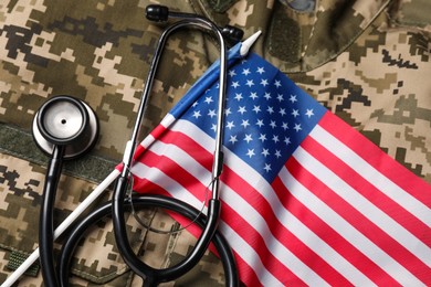 Photo of Stethoscope and USA flag on military uniform, top view