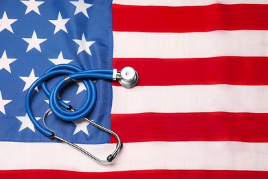 Stethoscope on USA flag, top view. Health care concept