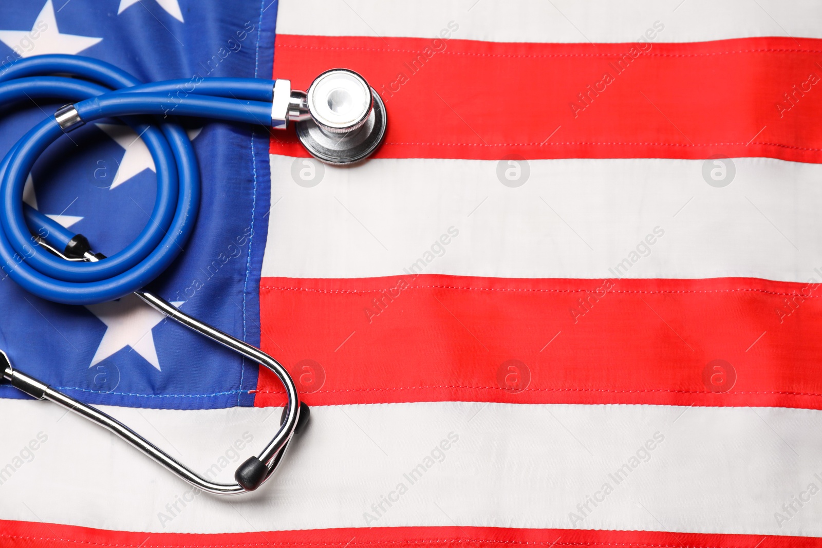 Photo of Stethoscope on USA flag, top view. Health care concept