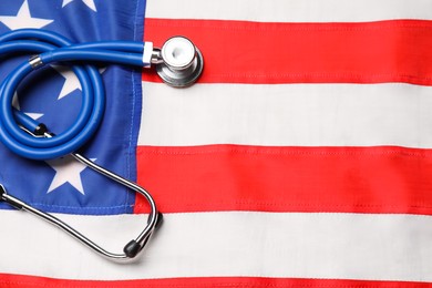 Photo of Stethoscope on USA flag, top view. Health care concept