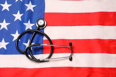 Photo of Stethoscope on USA flag, top view. Health care concept