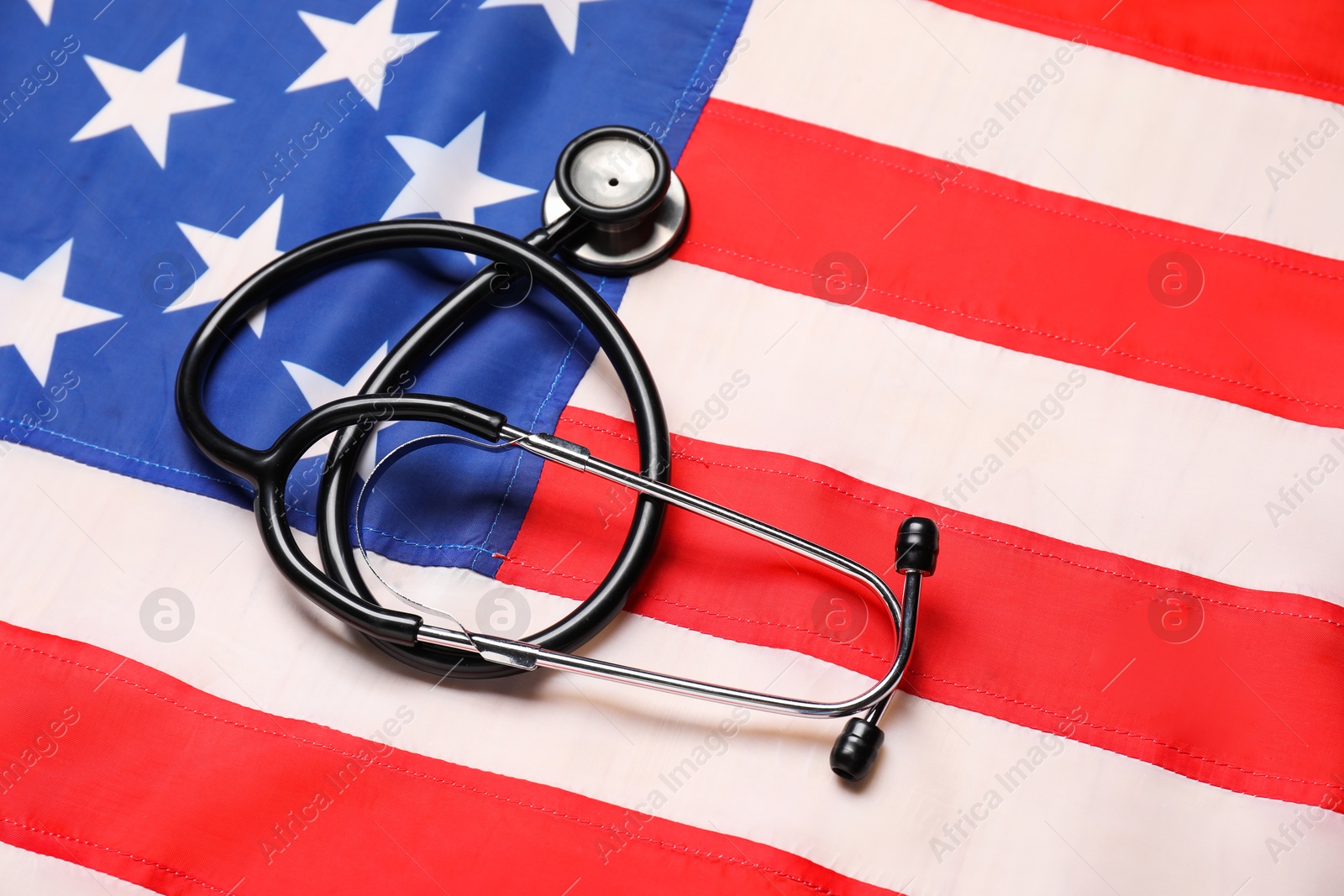 Photo of Stethoscope on USA flag, top view. Health care concept