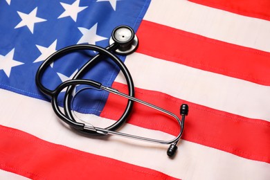 Photo of Stethoscope on USA flag, top view. Health care concept