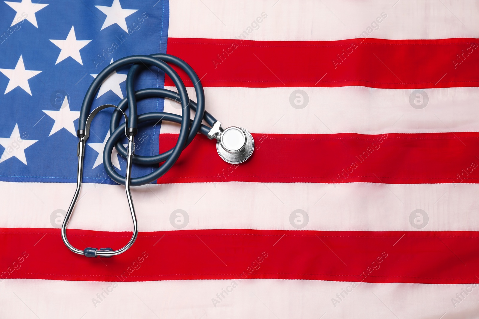Photo of Stethoscope on USA flag, top view. Health care concept