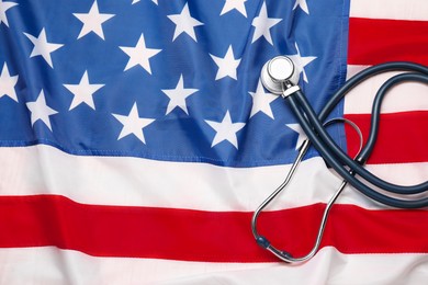 Photo of Stethoscope on USA flag, top view. Health care concept