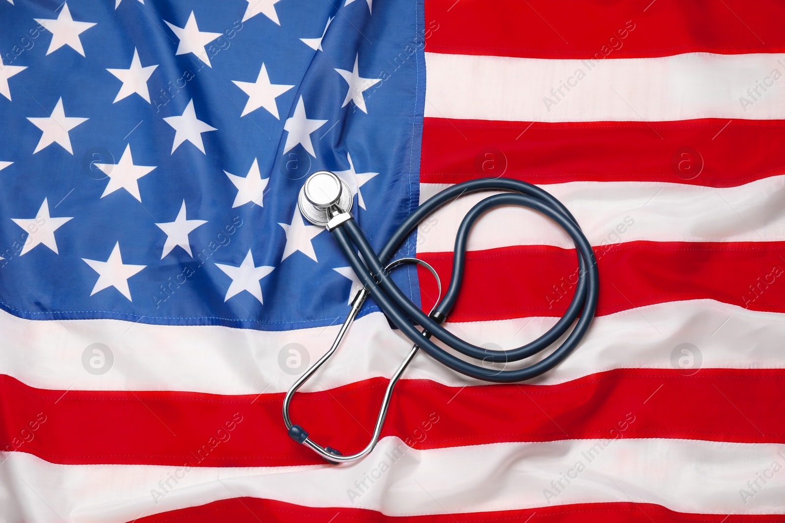 Photo of Stethoscope on USA flag, top view. Health care concept