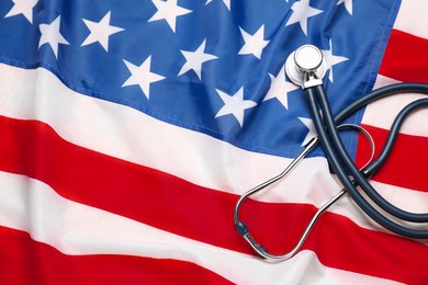 Photo of Stethoscope on USA flag, top view. Health care concept