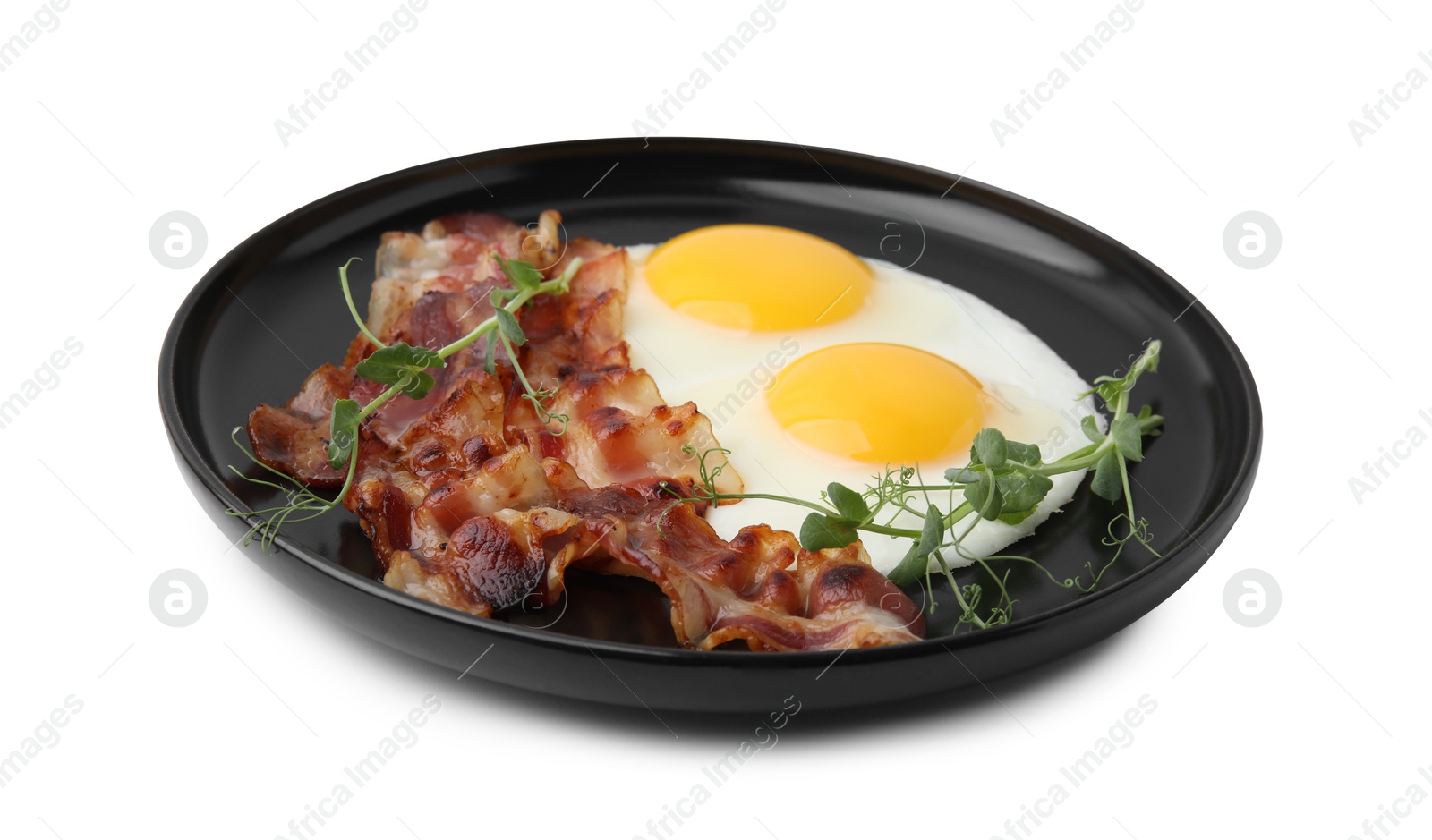 Photo of Fried eggs, bacon and microgreens isolated on white