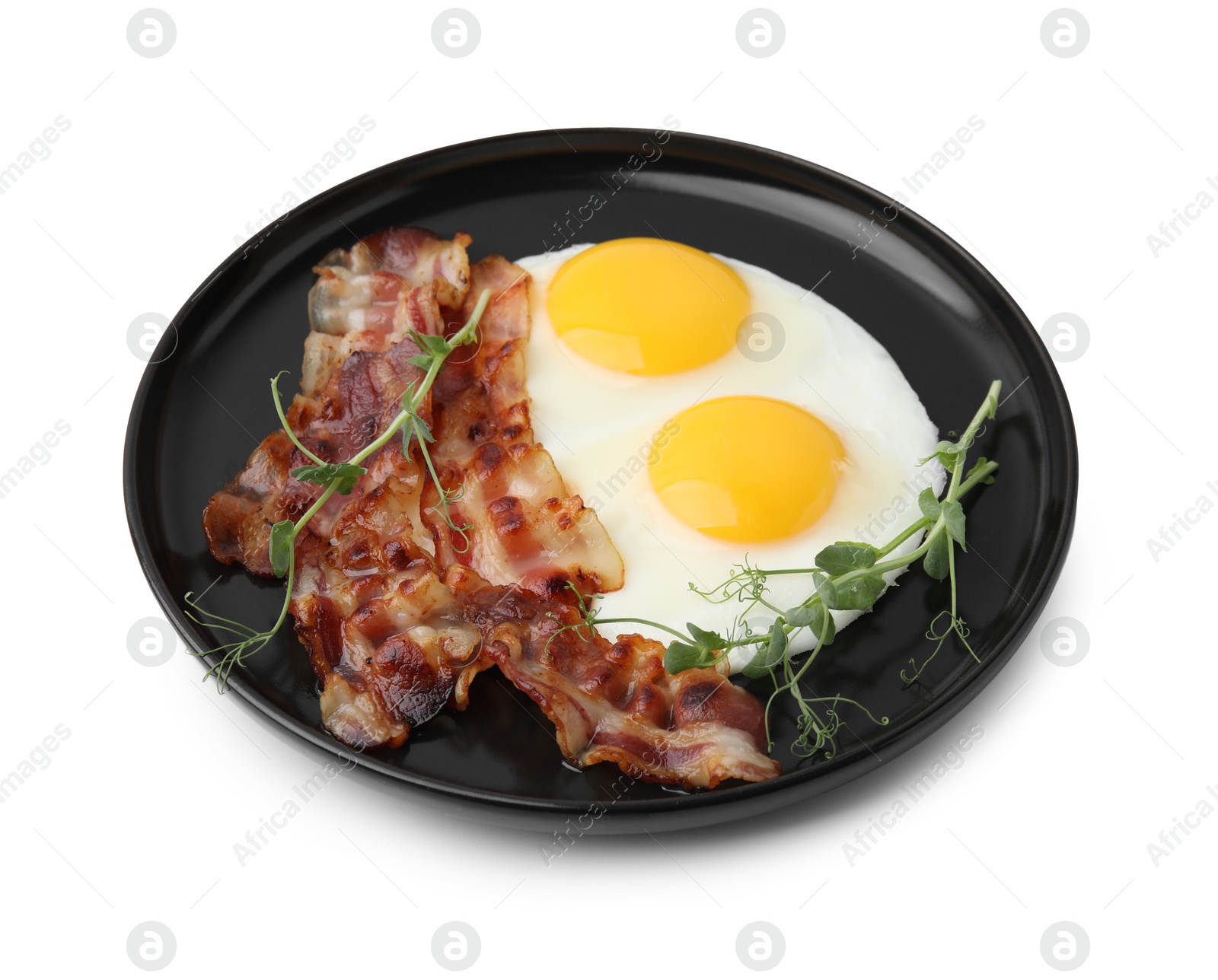 Photo of Fried eggs, bacon and microgreens isolated on white