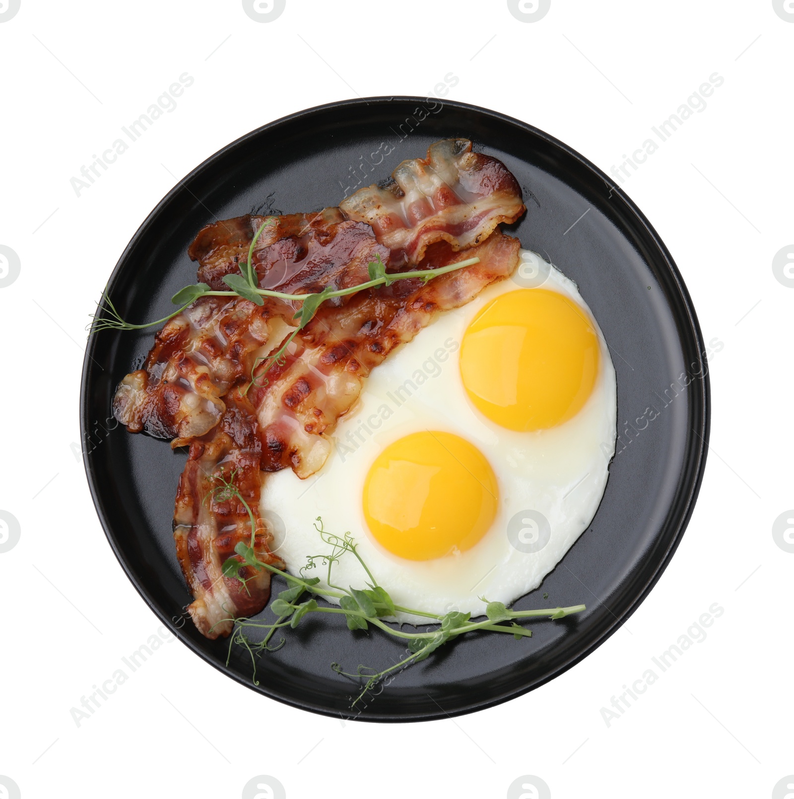 Photo of Fried eggs, bacon and microgreens isolated on white, top view