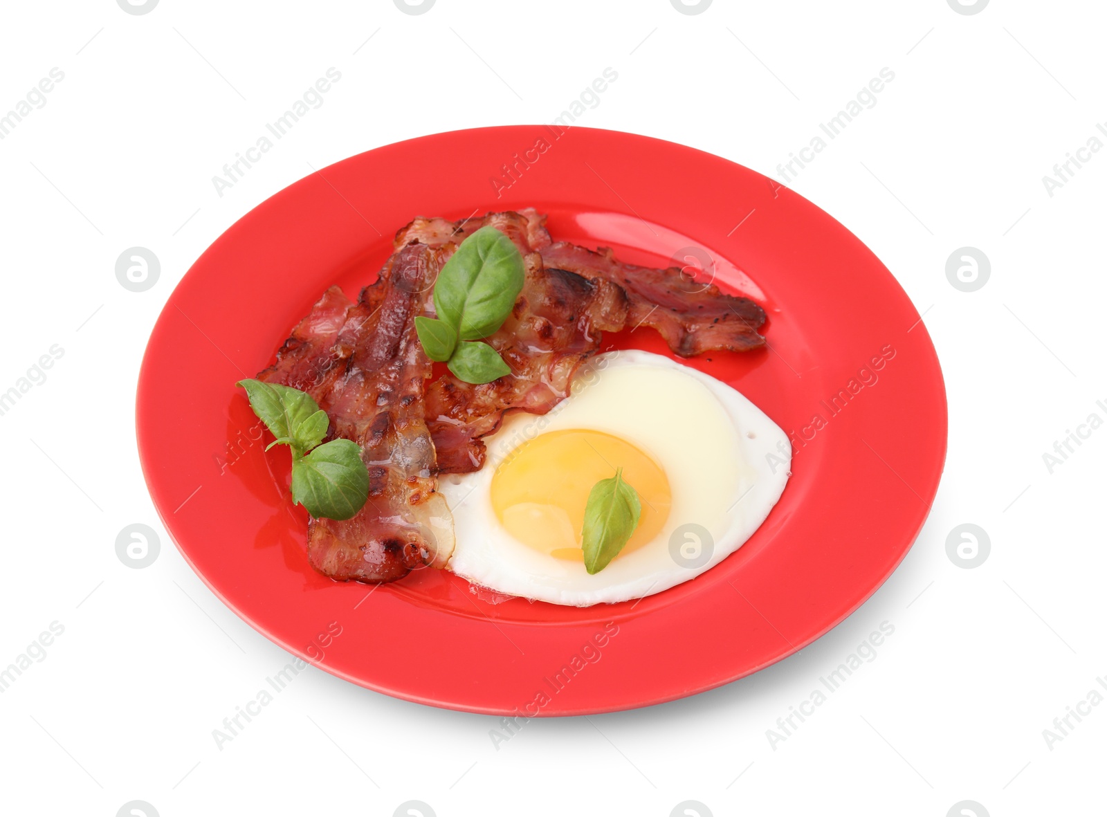 Photo of Fried egg, bacon and basil isolated on white