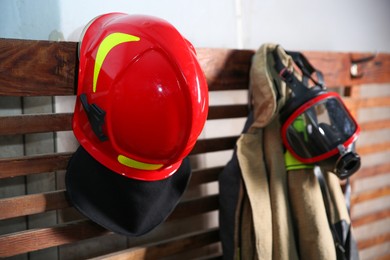 Photo of Firefighter`s uniform, helmet and mask at station