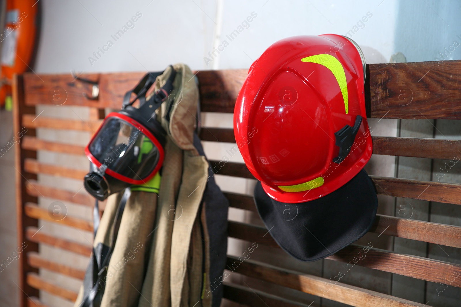 Photo of Firefighter`s uniform, helmet and mask at station