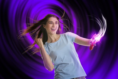 Excited woman playing video game with controller on color background. Light coming out from device