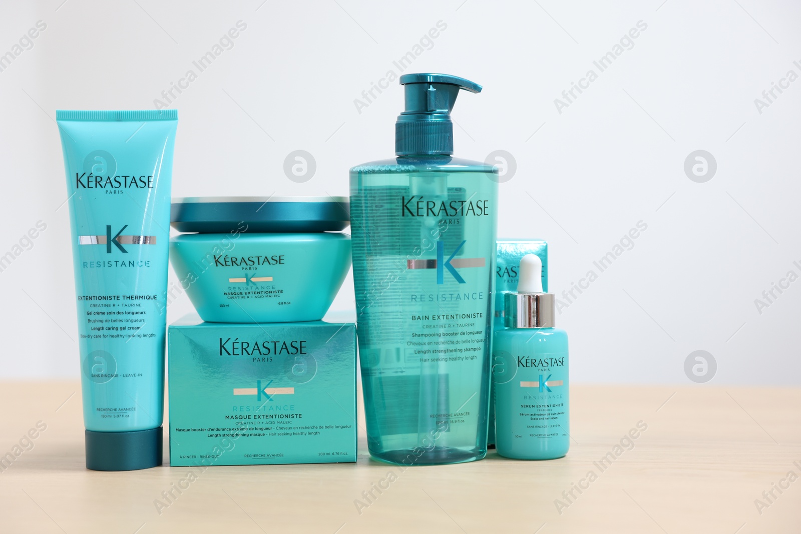 Photo of Leiden, Netherlands - June 11, 2024: Kerastase hair care cosmetic products on wooden table against light background