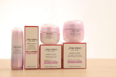 Leiden, Netherlands - June 11, 2024: Shiseido care cosmetic products on wooden table against light background