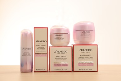 Photo of Leiden, Netherlands - June 11, 2024: Shiseido care cosmetic products on wooden table against light background