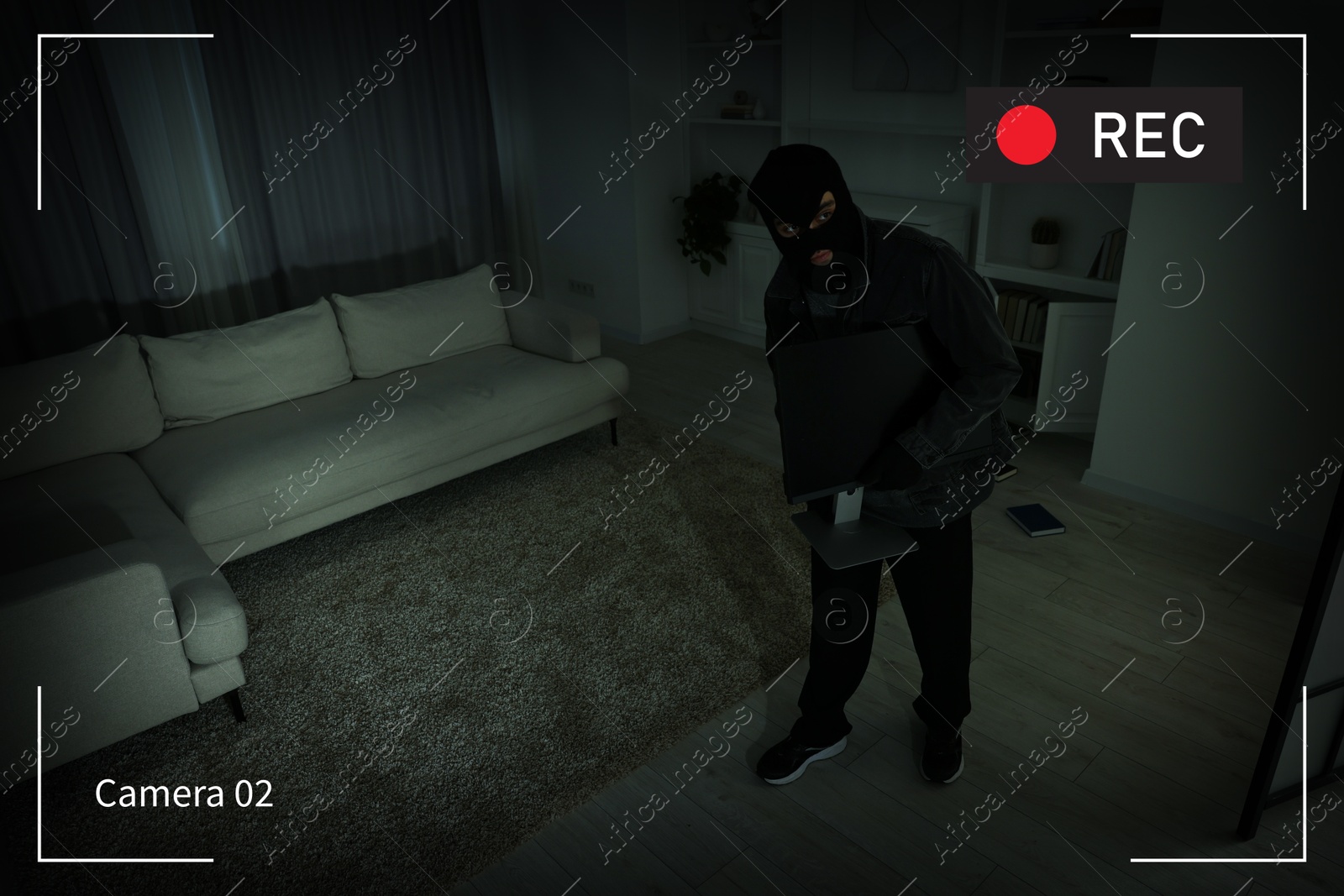 Image of Thief robbing house, view through surveillance camera