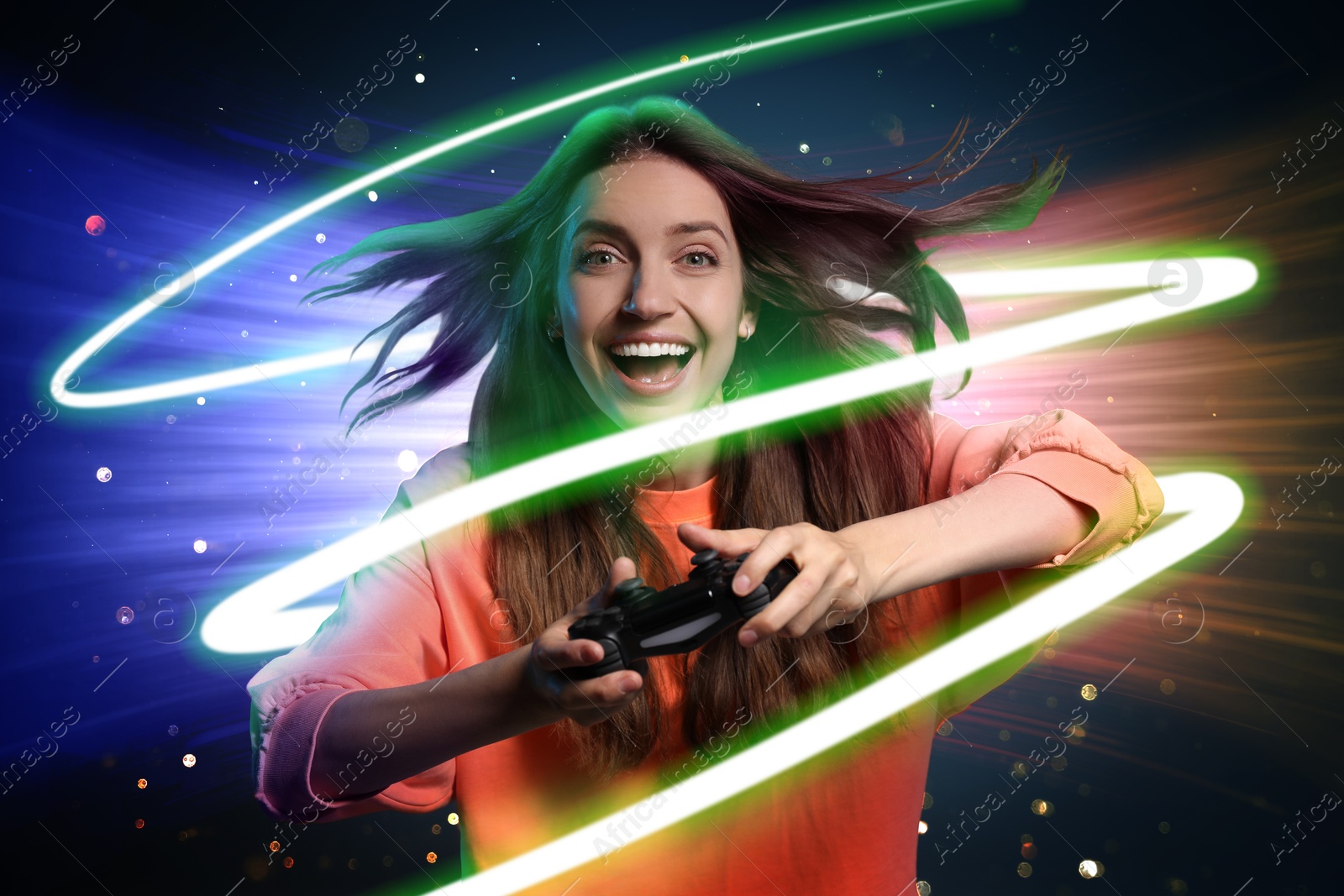 Image of Excited woman playing video game with controller on color background. Bright spiral around her