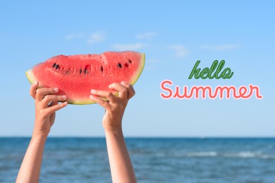 Hello Summer. Child holding watermelon slice near ocean, closeup