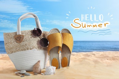 Hello Summer. Beach bag with different stuff on sea coast