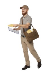 Happy young postman with brown bag delivering letters on white background