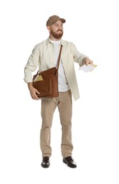 Happy young postman with brown bag delivering letters on white background