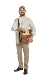 Happy young postman with brown bag delivering letters on white background