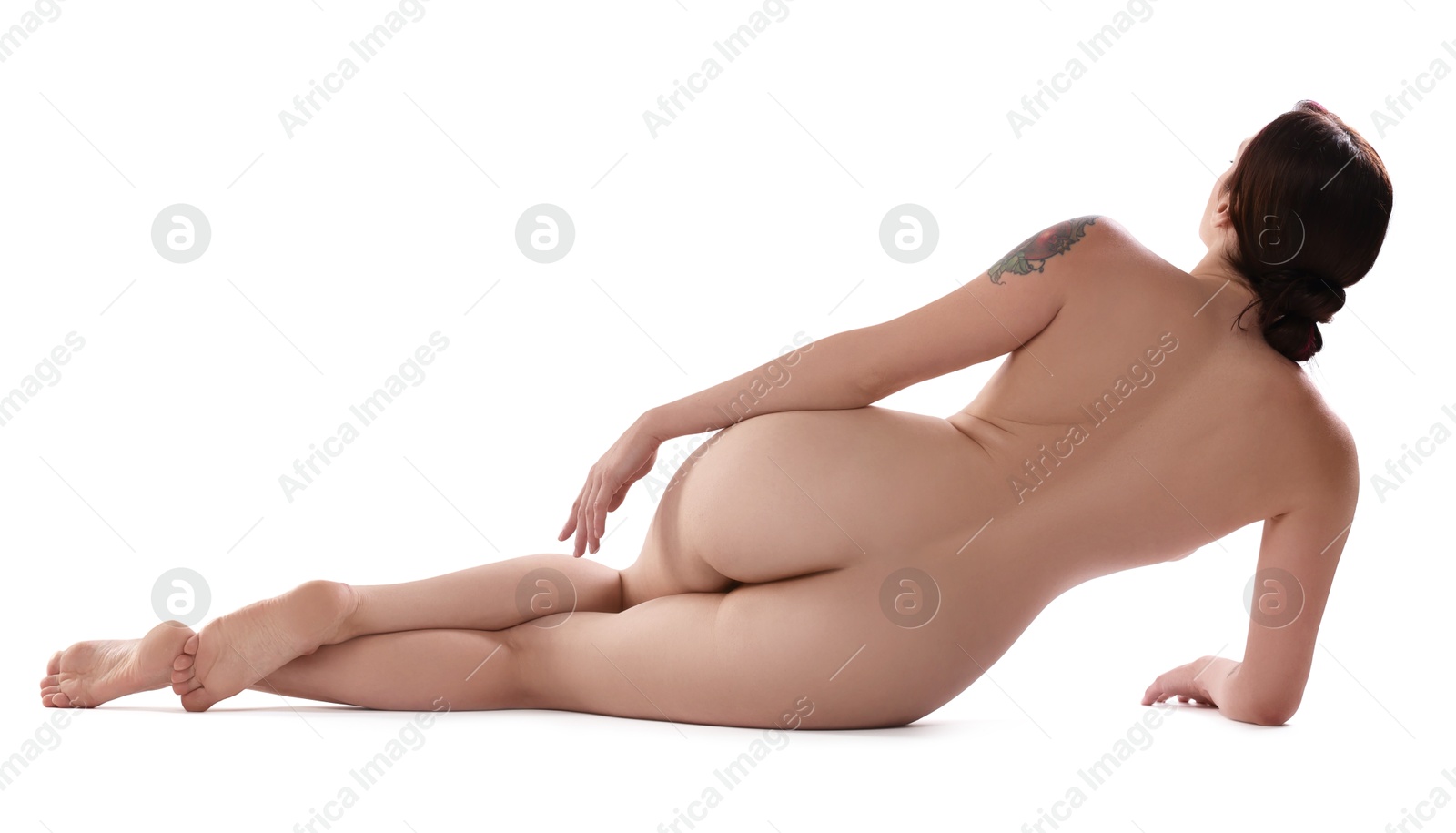 Photo of Nude woman posing on white background, back view