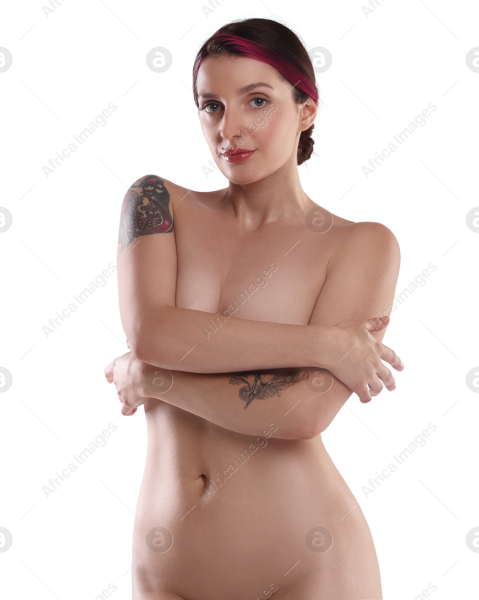 Photo of Beautiful nude woman with tattoos posing on white background