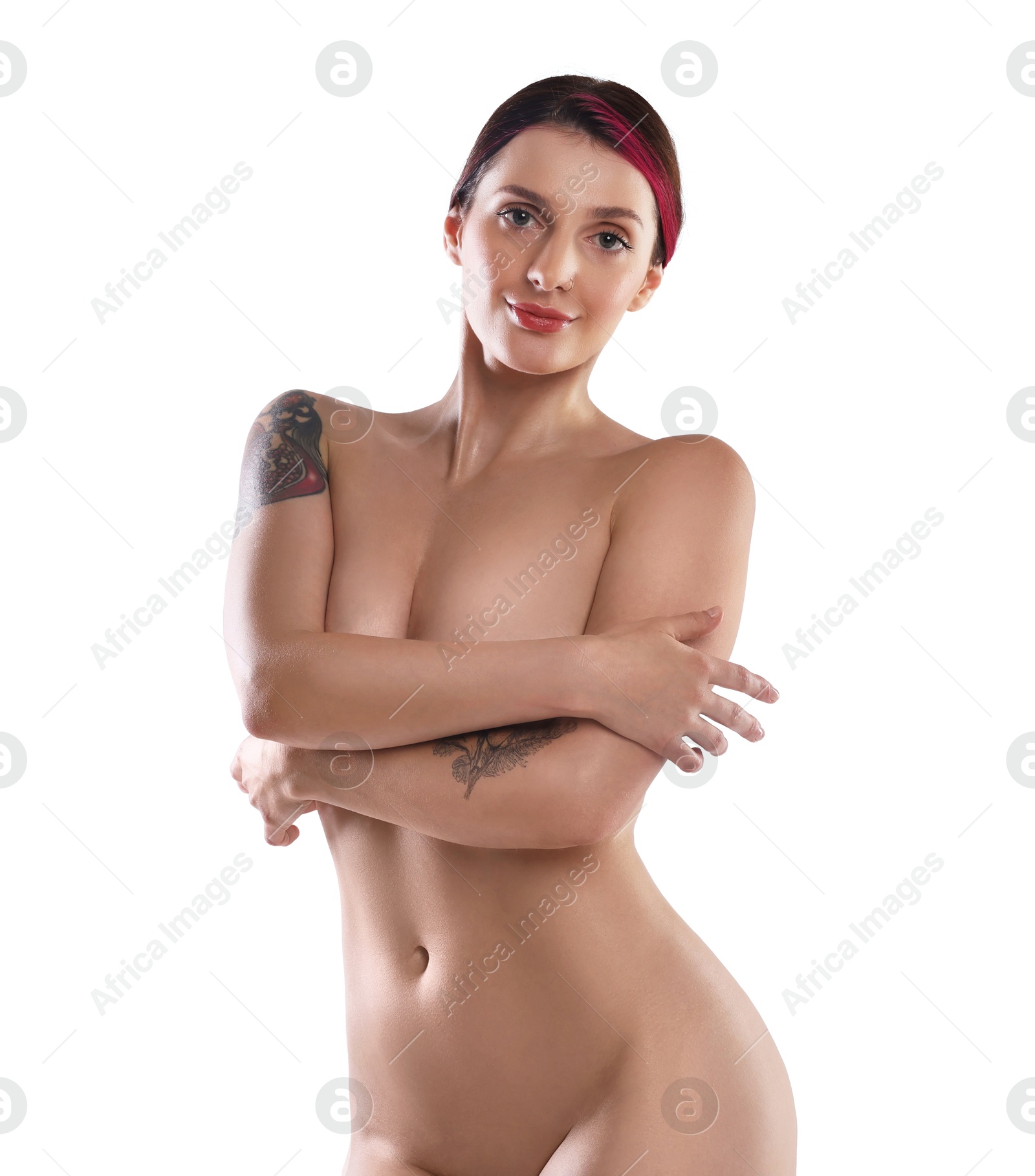 Photo of Beautiful nude woman with tattoos posing on white background