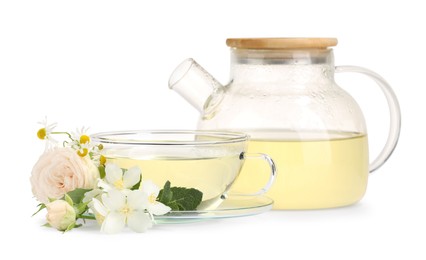 Photo of Aromatic herbal tea with different flowers and mint isolated on white