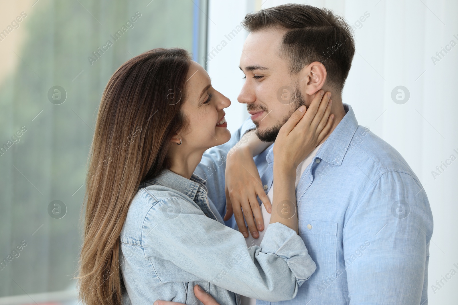 Photo of Lovely couple enjoying each other at home