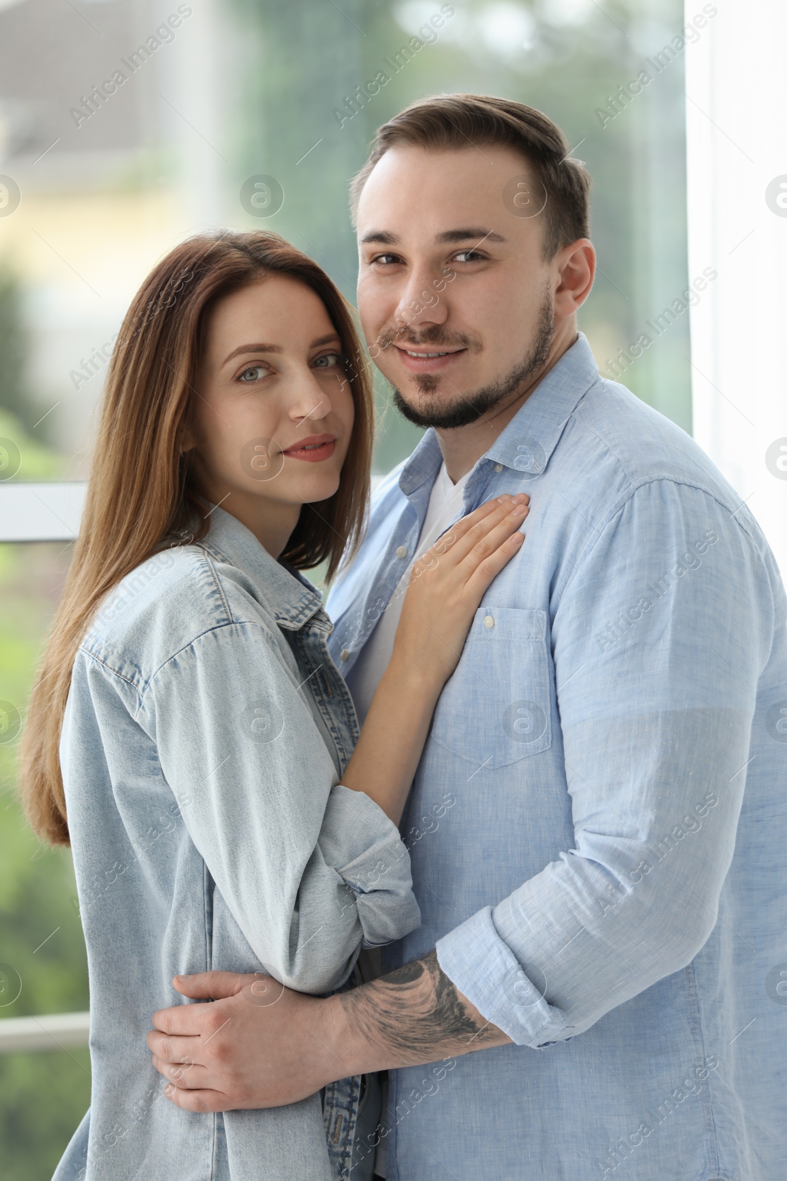 Photo of Cute couple hugging at home. Strong relationship