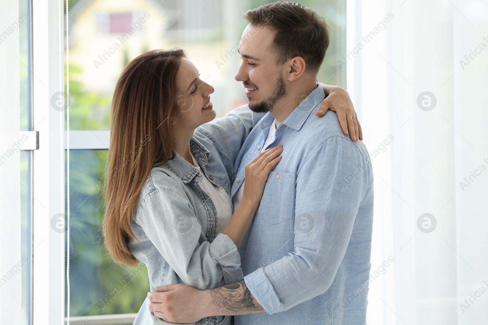 Photo of Happy couple hugging at home. Strong relationship