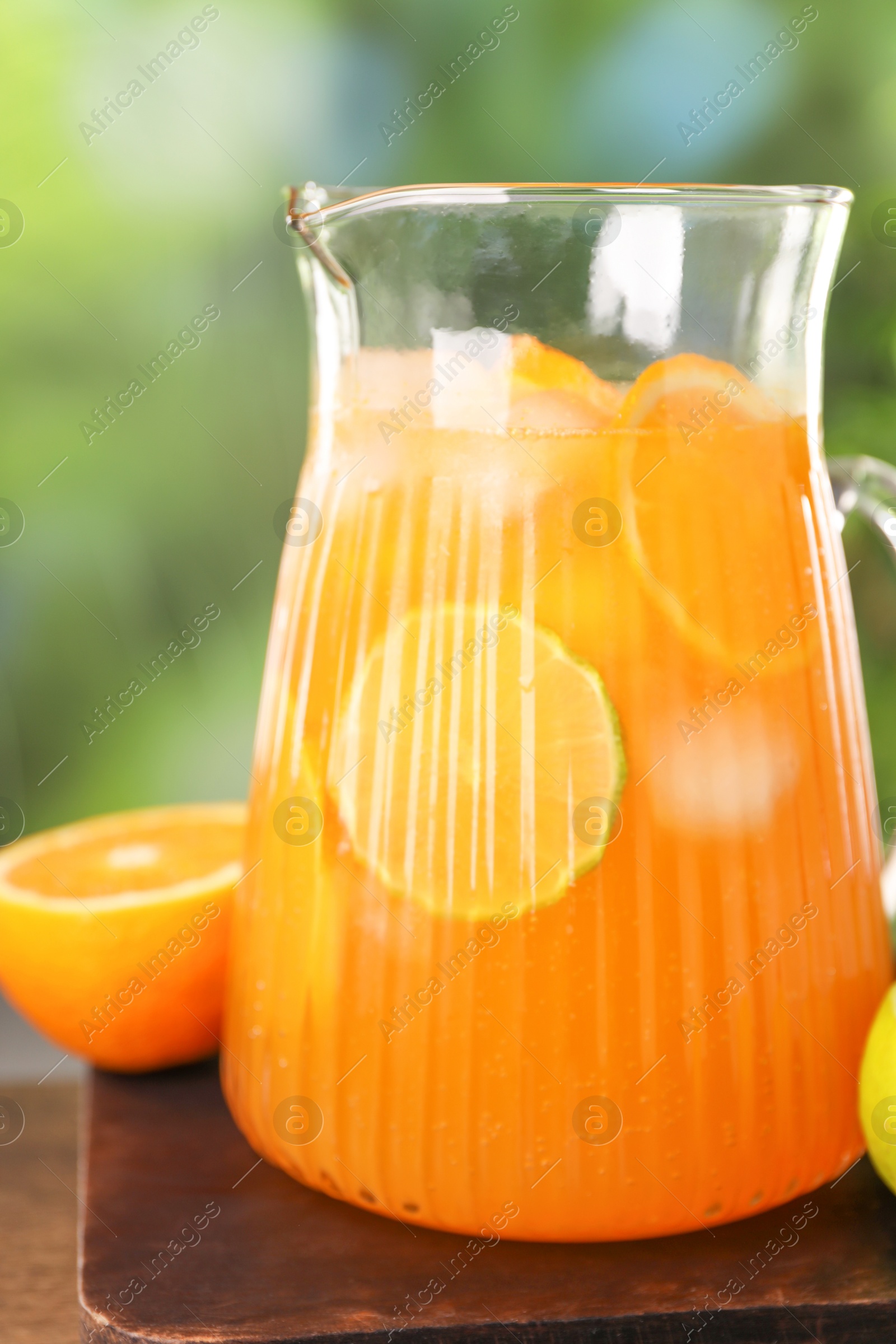 Photo of Freshly made lemonade in jug on table